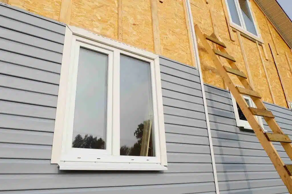 gray siding being installed on residential home; siding options